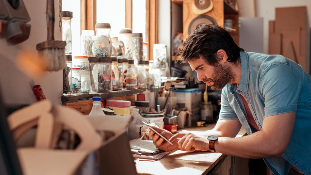 bearded-man-on-phone-at-work-in-workshop-5-Things-…-Do-To-Boost-Their-Location-Based-Marketing-ss | 5 Things Every Local Business Should Do To Boost Their Location Based Marketing | feature