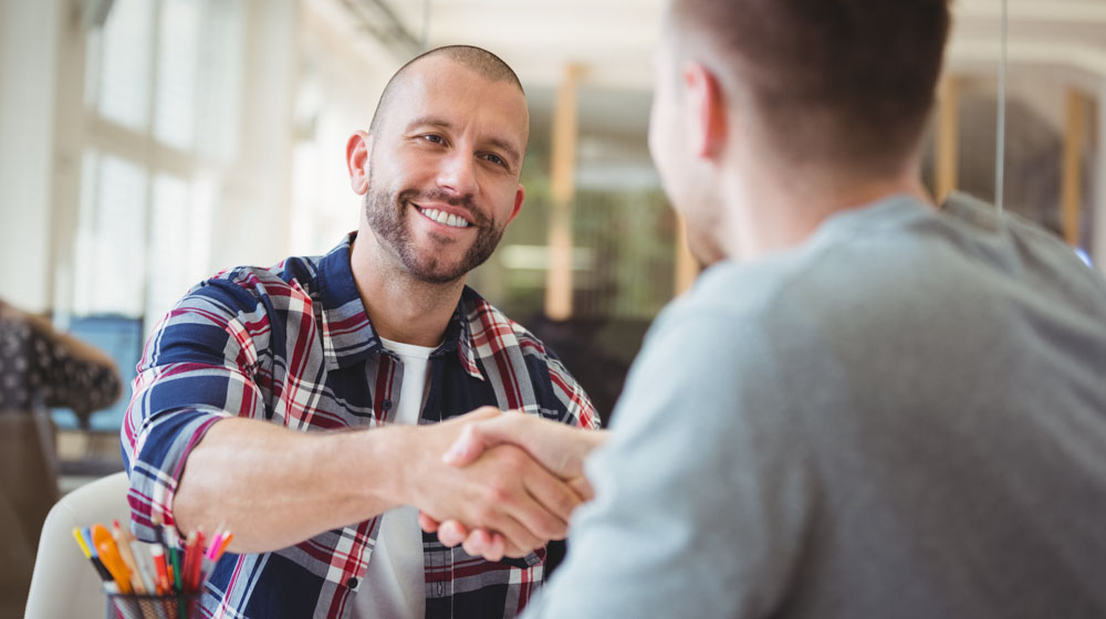 Young business men shaking hand in a coffee shop | Feature | 5 Benefits That Locl Can Bring Your Business